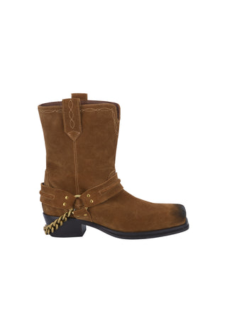 a-black-ankle-boot-with-a-chunky-block-heel-featuring-a-black-faux-leather-upper-a-black-suede-side-panel-a-black-elastic-side-strap-with-a-gold-tone-eyelet-and-a-small-gold-logo-on-the-side